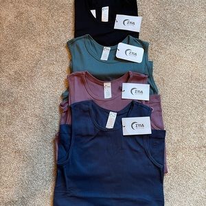 Four NWT Ziya Parallel tanks in size medium!